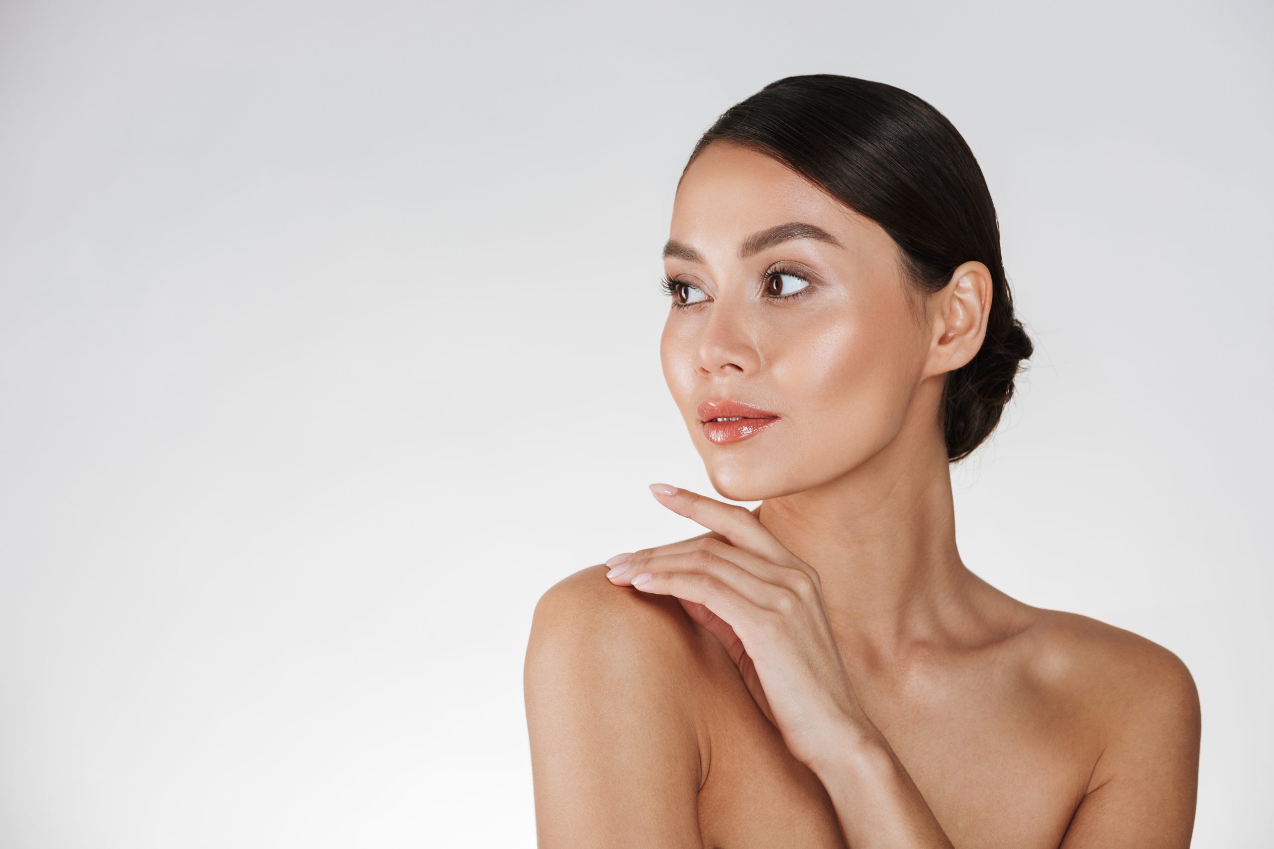 beauty portrait feminine young woman looking away touching her nude shoulder isolated white (1)